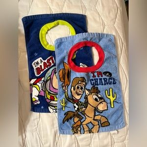 Toy Story bibs (2) one Woody and one Buzz. Towel like material.